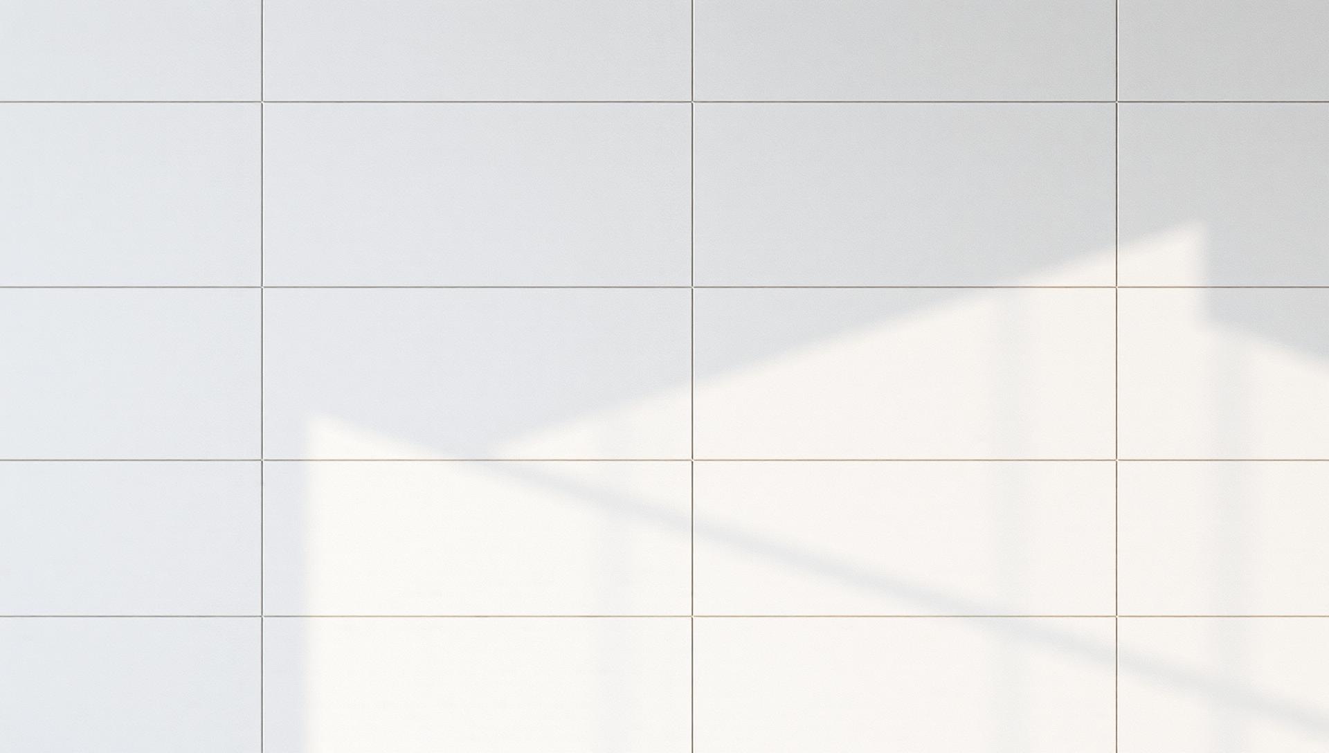 Pristine large-format light grey bathroom wall tiles — professional tile repair and re-glazing